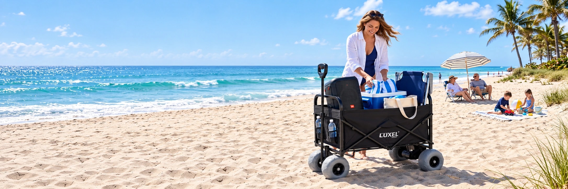 Black LUXEL electric beach wagon with balloon wheels and beach gear beside a family on the sand.